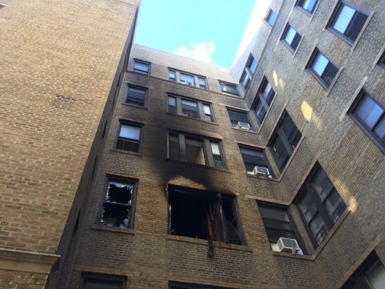 exterior view of fire damage to apartment building