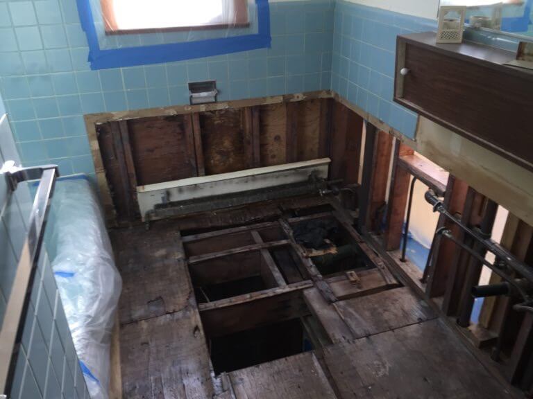 damaged plumbing in bathroom