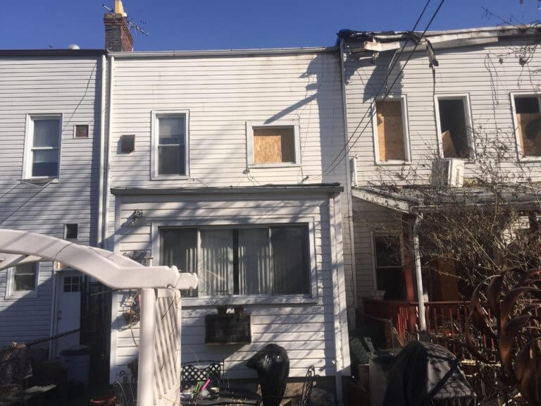view of exterior homes damaged in Queens