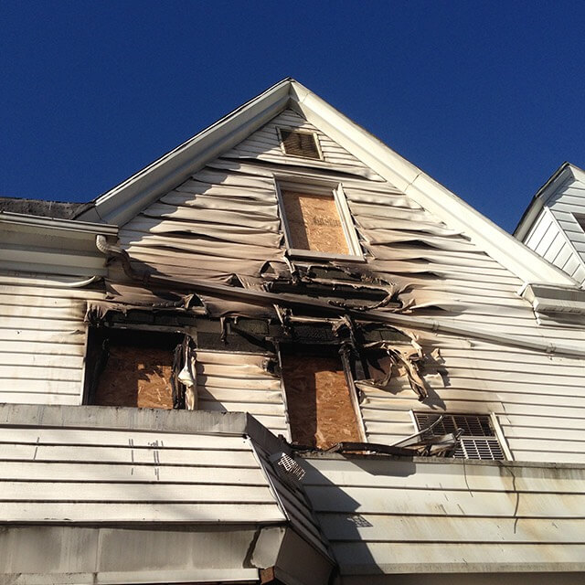 exterior fire damage on house, burnt siding