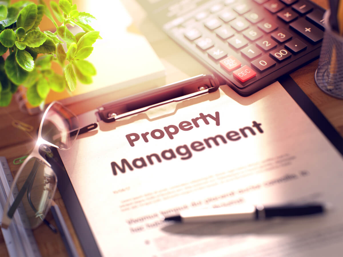 Business Concept - Property Management on Clipboard. Composition with Clipboard and Office Supplies on Office Desk. 3d Rendering. Blurred Illustration.