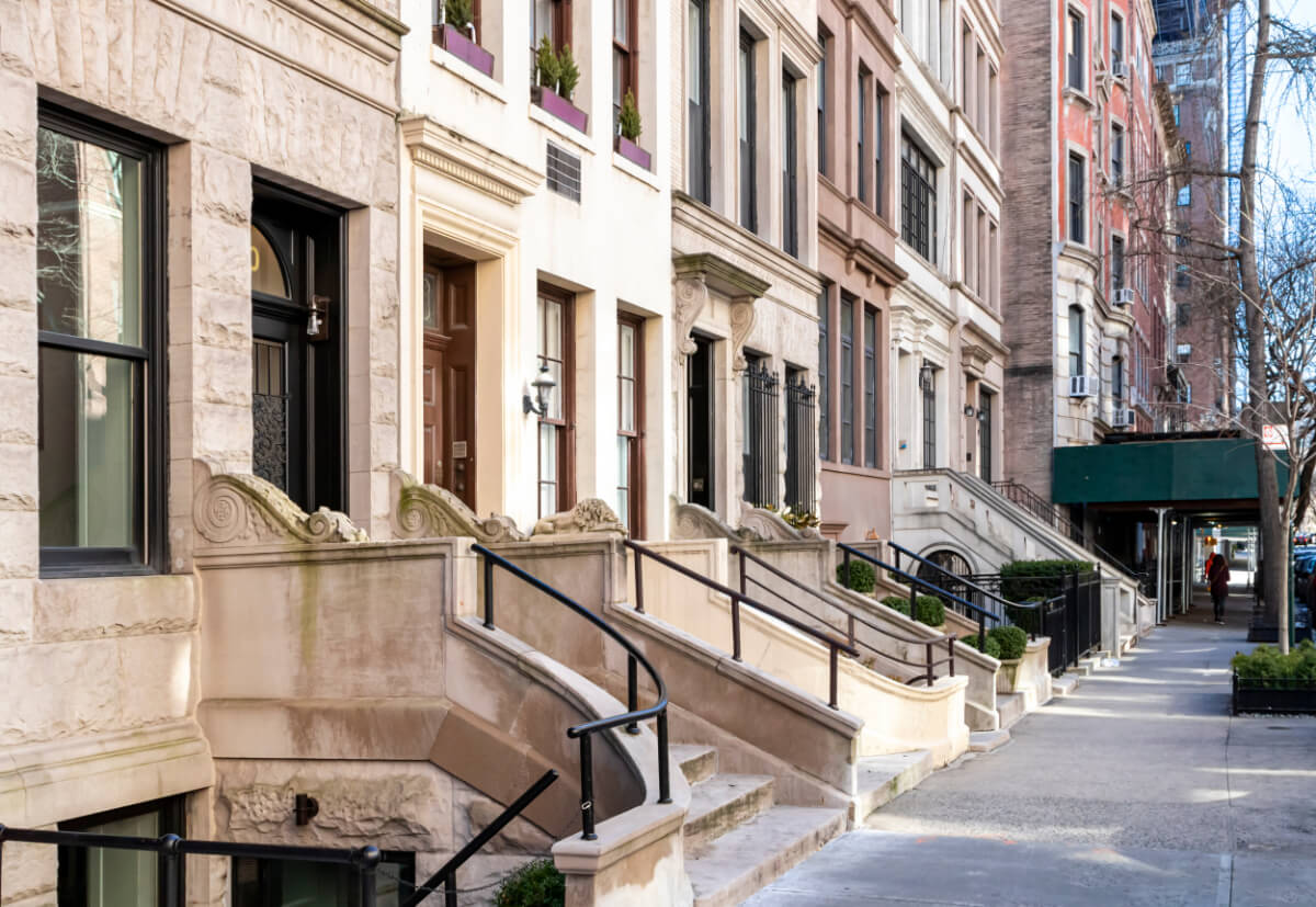 Empty Sidewalk In Front Of Old Brownstone Buildings