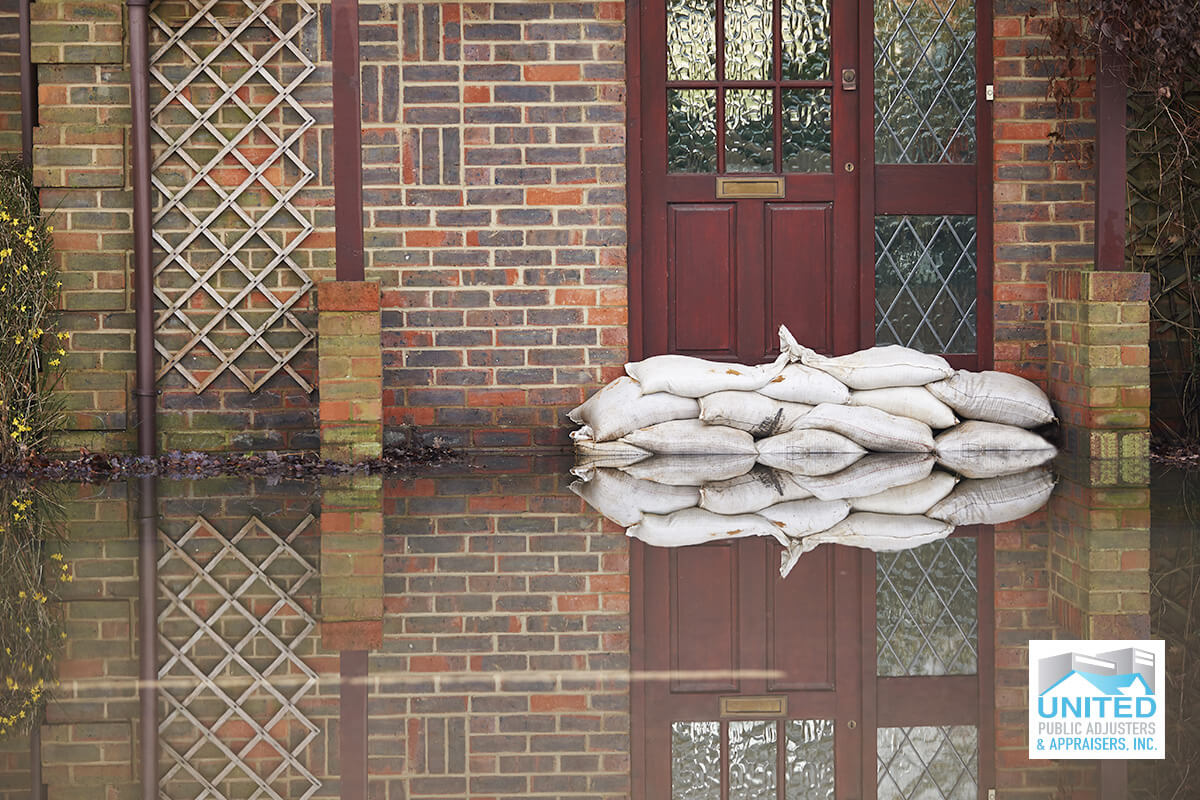 sandbags in front of home during a flood