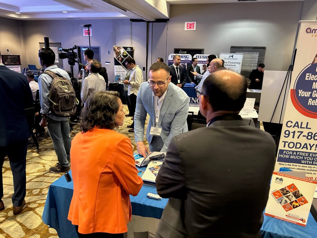 UPA booth speaking to interested clients