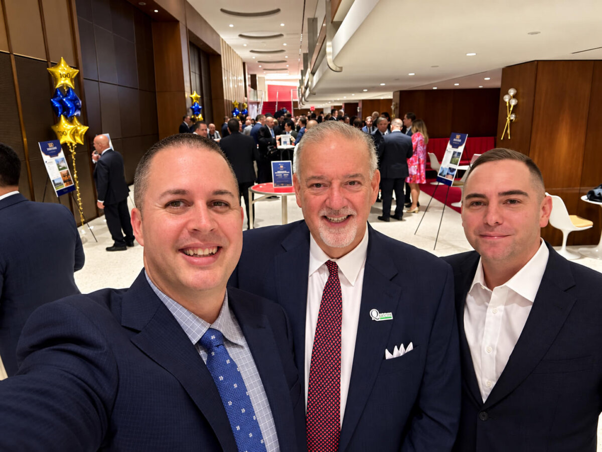 Three Men at a Formal Networking Reception1